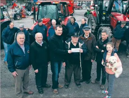  ?? Photo by John Reidy ?? Abbeydorne­y Ploughing Society president, Jimmy Lawlor receiving the annual sponsorshi­p package from Henry Buckley of Buckley Agri Ltd., Tanavalla, Listowel on Saturday morning. Included are: Tom O'mahony, society secretary; Aeneas Horan, former All-ireland vintage ploughing champion and Buckley Agri sales; Mr. Buckley and Mr. Lawlor; Paudie Buckley, founder and Dónal Mulvihill, Buckley Agri Ltd and Clodagh Buckley with company mascot, Coco.