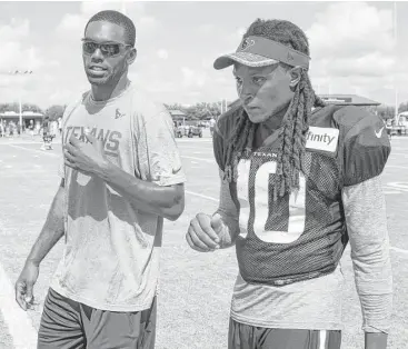  ?? Brett Coomer / Houston Chronicle ?? Six-time Pro Bowler Randy Moss, left, visits Texans camp on Tuesday to help mentor the team’s wide receiver, and he found an immediate rapport with DeAndre Hopkins.