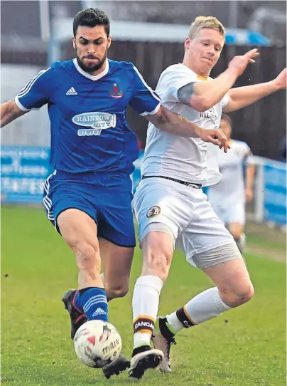  ??  ?? TWIN OBJECTIVE: Graham Fraser, right, in a challenge with Cove’s Kareem Hassanein