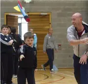  ??  ?? Coach Aaron Costello takes Ransboro NS through the Indoor Javelin Throw in IT Sligo.