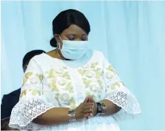  ?? ?? First Lady Auxillia Mnangagwa in prayer in Bulawayo yesterday.