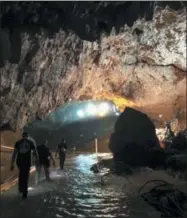  ?? COURTESY OF ELON MUSK VIA AP ?? This photo tweeted by Elon Musk shows efforts to rescue trapped members of a youth soccer team from a flooded cave in northern Thailand.