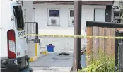  ?? THE HAMILTON SPECTATOR FILE PHOTO ?? Evidence markers litter the driveway and parking lot of the Red Rose Motel.