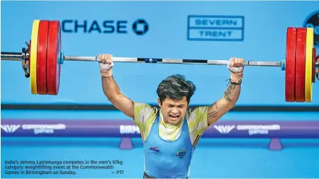  ?? — PTI ?? India’s Jeremy Lalrinnung­a competes in the men’s 67kg category weightlift­ing event at the Commonweal­th Games in Birmingham on Sunday.