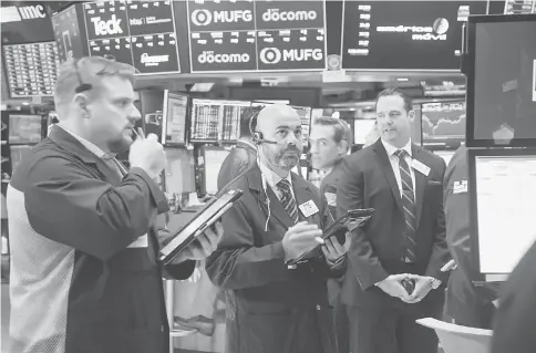  ??  ?? Traders work on the floor of the New York Stock Exchange in New York on Sept 25. — WP-Bloomberg photo