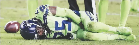  ??  ?? La blessure subie par Richard Sherman, des Seahawks de Seattle, a remis à l’avant-plan le débat sur les matchs du jeudi soir. Les Seahawks n’ont joué qu’après trois jours de congé. - Associated Press: Rick Scuteri