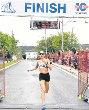  ?? KENN OLIVER/THE TELEGRAM ?? Jennifer Murrin of St. John’s shows winning form to close out her race in the 91st Tely 10 Sunday. Murrin covered the 10 miles in 56:58 to win her second straight Tely 10 crown. Her time was the sixth-fastest ever recorded, and she finished ninth...