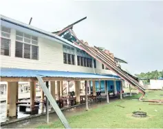  ??  ?? The roofs of buildings at SK Pekan Telupid were ripped off or damaged in a storm on June 18 last year.