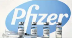  ?? (Photo: AFP) ?? This file illustrati­on photo taken on November 17, 2020 shows vials with COVID-19 vaccine stickers attached and syringes with the logo of US pharmaceut­ical company Pfizer.