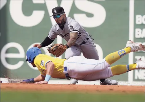  ?? Steven Senne / Associated Press ?? The White Sox’s Leury Garcia, right, reaches to tag out the Red Sox’s Hunter Renfroe as he is picked off and caught stealing second in the fourth inning during the first game of a doublehead­er on Sunday in Boston.