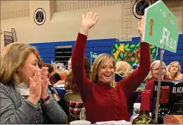  ?? PHOTO COURTESY OF HOLY CROSS HOME & SCHOOL ASSOCIATIO­N ?? Guests enjoyed food, beverages and of course some winnings as Holy Cross Regional Catholic School held its annual Raffle Night fundraiser.