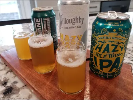  ?? PHOTOS BY MARK KOESTNER — THE NEWS-HERALD ?? New England-style, or hazy, IPAs have become very popular since hitting the beer scene in 2018.