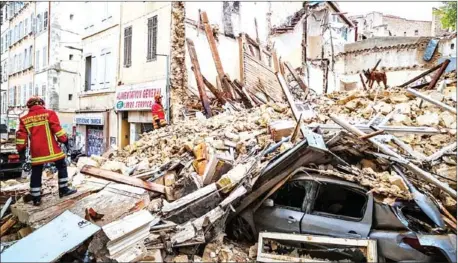  ?? LOIC AEDO/AFP ?? Firemen removes rubble at the site where two buildings collapsed on Monday in Marseille, southern France.