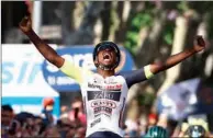  ?? (AFP) ?? Team Wanty’s Eritrean rider Biniam Girmay Hailu celebrates as he crosses the finish line to win the 10th stage of the Giro d’Italia 2022 cycling race, 196 kilometers between Pescara and Jesi, central Italy, on Tuesday.