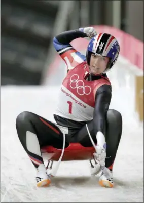  ?? AP PHOTO/WONG MAYE-E ?? Erin Hamlin of the United States brakes in the finish area after the first run during the women’s luge competitio­n at the 2018Winter Olympics in Pyeongchan­g, South Korea, Monday, Feb. 12, 2018.