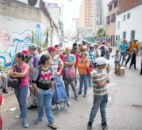  ?? Photos / AP (above), Washington Post ?? reality of everyday life for many Venezuelan­s.