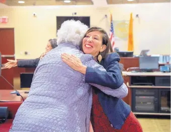  ?? EDDIE MOORE/JOURNAL ?? Teresa Leger Fernandez, now the Democratic Party nominee in the 3rd Congressio­nal District, receives congratula­tions in November 2017 from Anne Noss, one of the plaintiffs she represente­d in a case she helped win against the city of Santa Fe over Ranked Choice Voting.