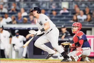 ?? Jim McIsaac / Getty Images ?? The Yankees’ Luke Voit follows through on a third-inning two-run double against the Twins on Aug. 19 at Yankee Stadium.
