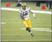  ?? BUTCH DILL — THE ASSOCIATED PRESS ?? Green Bay Packers quarterbac­k and Chico native Aaron Rodgers (12) carries in the first half Sunday against the New Orleans Saints in New Orleans.