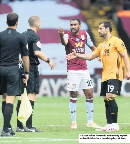  ??  ?? > Aston Villa’s Ahmed El Mohamady argues with officials after a match against Wolves