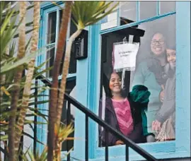  ?? I rfan Khan Los Angeles Times ?? MARTHA ESCUDERO with daughters Meztli, 8, left, and Victoria, 10, inside a vacant house they occupied in March. “Everyone deserves this,” Escudero said.