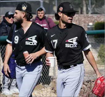  ?? MATT YORK — THE ASSOCIATED PRESS ?? Chicago White Sox pitchers Kendall Graveman and Joe Kelly (17) arrive for a spring training baseball practice on, Wednesday, Feb. 15, 2023, in Phoenix.