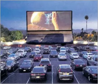  ?? Ana Venegas For The Times ?? VAN BUREN Drive-In is 55 years old and fresh as ever. The Riverside theater draws a crowd for its double features. “This is better for meeting people” than indoor cinemas, fan Savana Spina says.