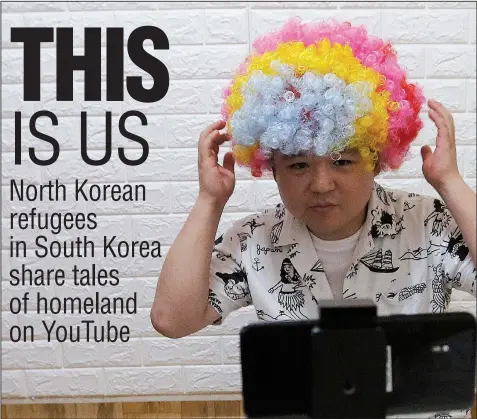  ?? AP PHOTO/AHN YOUNG-JOON ?? North Korean refugee Jang Myung-jin films himself in a demonstrat­ion of his YouTube broadcast during an interview at his house in Seoul, South Korea, in this July photo. The 32-year-old Jang is among a handful of young North Korean refugees in South Korea who have launched YouTube channels that offer a rare glimpse into the everyday lives of people in North Korea, one of the world’s most secretive and repressive countries.