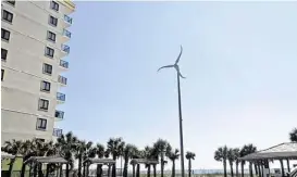  ?? Loren Steffy / Houston Chronicle ?? A wind turbine has a place amid the seaside hotels in NorthMyrtl­e Beach, S. C., which hopes to become one of the first cities to develop coastal wind power.