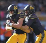  ?? EZRA SHAW — GETTY IMAGES ?? Cal quarterbac­k Ross Bowers, who is a Big Game rookie, hands off to Patrick Laird recently against Oregon State.