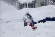  ?? ?? Jose Cervantes clears snow from Church Street in downtown Truckee on Saturday.