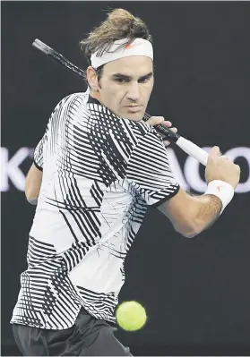  ?? Picture: AFP ?? TAKE THAT! Roger Federer returns against Mischa Zverev during their Australian Open quarterfin­al in Melbourne yesterday.