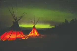  ?? GREG OLSEN ?? Tour operators in Whitehorse take people outside the city to heated yurts to stay warm while waiting for the northern lights to appear. Many Northern Canadian communitie­s are ideal spots to see the lights.