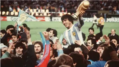  ??  ?? Argentina captain Daniel Passarella holding the FIFA World Cup after his side’s triumph over the Netherland­s in the final.