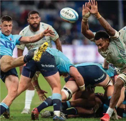  ?? Photo: Leon Lord ?? Swire Shipping Fijian Drua openside flanker Vilive Miramira blocks a kick from a Waratahs player during their round 14 Shopn N Save Super Rugby Pacific match at Allianz Stadium, Sydney, Australia on May 20, 2023.