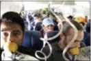  ?? MARTY MARTINEZ VIA AP ?? In this photo provided by Marty Martinez, Martinez, left, appears with other passengers after a jet engine blew out on the Southwest Airlines Boeing 737 plane he was flying in from New York to Dallas, resulting in the death of a woman who was nearly...
