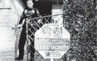  ?? Elizabeth Conley / Staff photograph­er ?? SEAL security guard Viktor Sadabian checks on a home in Sharpstown. Some residents see a plan to create an HOA there as a better way to raise funds for neighborho­od security.