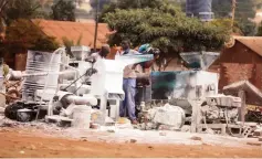  ??  ?? Grinding mill operators go about their business in open spaces in Hatcliffe, Harare, yesterday, following the demolition of their structures by council during a recent clean-up exercise. — Picture: Justin Mutenda