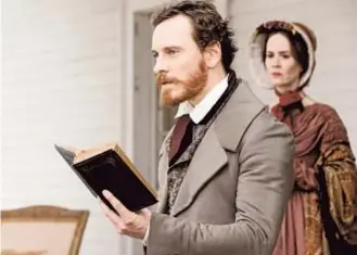  ?? Francois Duhamel Fox Searchligh­t ?? MICHAEL FASSBENDER portrays a volatile plantation owner in “12 Years a Slave.” Sarah Paulson plays his wife. Steve McQueen directs.