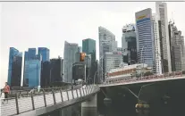  ?? EDGAR SU/REUTERS FILES ?? Singapore was ranked the most competitiv­e economy for the second year in a row. Canada moved up to eighth spot.