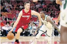  ?? JOHN MCCALL/STAFF PHOTOGRAPH­ER ?? Guard Goran Dragic was 9-of-17 shooting in leading the Heat with 25 points.