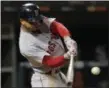  ?? JIM YOUNG - THE ASSOCIATED PRESS ?? FILE - In this Thursday, Aug. 30, 2018, file photo, Boston Red Sox’s Mookie Betts hits a two-run home run against the Chicago White Sox during the seventh inning of a baseball game in Chicago.