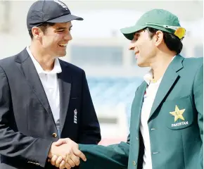  ??  ?? Battle: Misbah, right, earned a 2-2 draw with Alastair Cook’s England