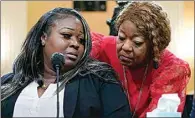  ?? JACQUELYN MARTIN / AP ?? Wandrea “Shaye” Moss, a former Georgia election worker, is comforted by her mother Ruby Freeman, right, as the House select committee investigat­ing the Jan. 6 attack on the U.S. Capitol continues to reveal its findings of a year-long investigat­ion, at the Capitol in Washington on Tuesday.