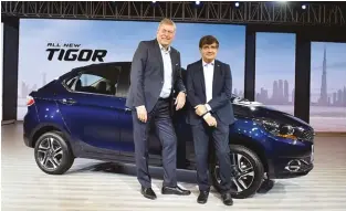  ??  ?? Guenter Butschek, CEO &amp; MD, and Mayank Pareek, president – PV business unit, Tata Motors at the launch of the all new Tigor