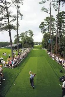  ?? David J. Phillip / Associated Press 2002 ?? In his mind, Chronicle columnist Bruce Jenkins tipped his cap to a wildly enthusiast­ic crowd as he walked up the 18th.