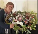  ?? ?? Schoolhous­e member Kathy Condiff of Ridley Township was the big winner in the Basket of Cheer raffle at the 2022School­house Senior Center Spring Fling.