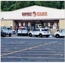  ?? JAMES RIDER / STAFF ?? Police were on the scene of the Family Dollar store at 440 James H. McGee Boulevard on Sunday evening where two people died from gunshots.