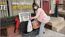  ?? SUBMITTED PHOTO ?? The Richard A Zuber Realty community food drive concluded on Martin Luther King’s National Day of Service on Jan. 18. Pictured collecting donations dropped off at the Boyertown office is Heidi Sollinger, administra­tive assistant with Zuber Realty, Boyertown.