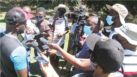  ??  ?? MEDIA SCRUM. . . Dynamos coach, Tonderai Ndiraya (left), addresses the media at the Glamour Boys’ training session, in Harare yesterday , as the Harare giants prepared for their Uhuru Cup showdown against Highlander­s, at the National Sports Stadium, on Sunday — Picture by Kudakwashe Hunda